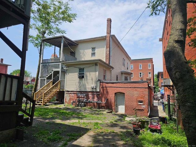 763 Park St, Hartford, CT 06106 - rear view of property with stairs and brick siding