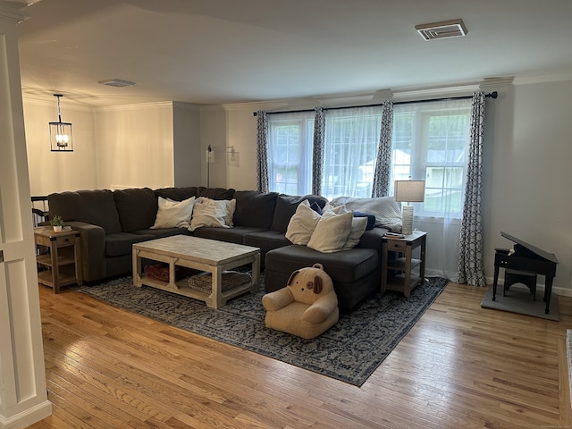 305 Rambler St, Bristol, CT 06010 - living area with light wood-style flooring, crown molding, and a chandelier