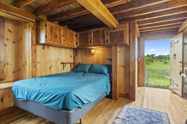 0 Ely Mdws, Lyme, CT 06371 - bedroom with a wooden ceiling with exposed beams, light wood finished floors, and wooden walls