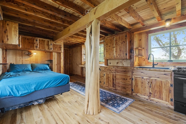 0 Ely Mdws, Lyme, CT 06371 - bedroom with a wooden ceiling with exposed beams, multiple windows, light wood-style flooring, and wooden walls