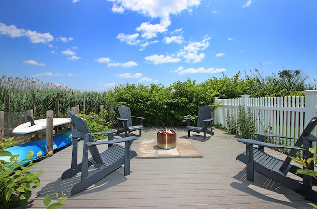 96 Chalker Beach Rd, Old Saybrook, CT 06475 - wooden terrace featuring an outdoor fire pit
