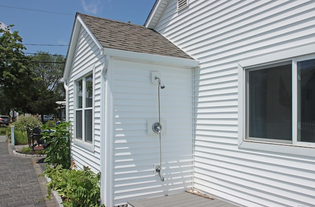 96 Chalker Beach Rd, Old Saybrook, CT 06475 - view of property exterior featuring roof with shingles