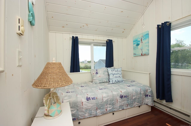 96 Chalker Beach Rd, Old Saybrook, CT 06475 - bedroom featuring baseboard heating, vaulted ceiling, wood finished floors, and multiple windows