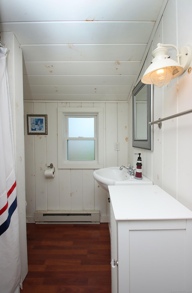 96 Chalker Beach Rd, Old Saybrook, CT 06475 - bathroom featuring a baseboard radiator, wood finished floors, vanity, and a shower with curtain