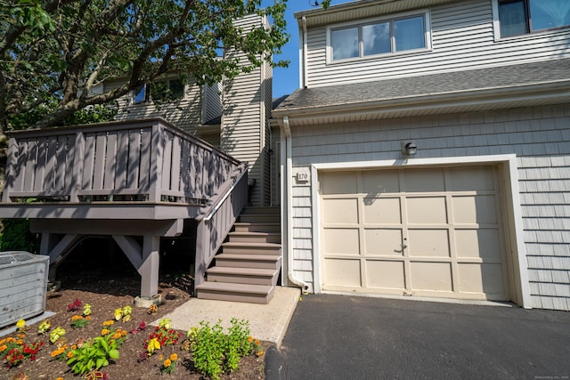 170 Turtle Bay Dr Unit 170, Branford, CT 06405 - doorway to property featuring a shingled roof, an attached garage, and driveway