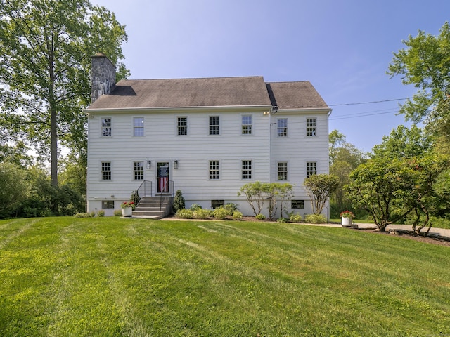 109 Westport Rd, Wilton, CT 06897 - back of house featuring a chimney and a yard