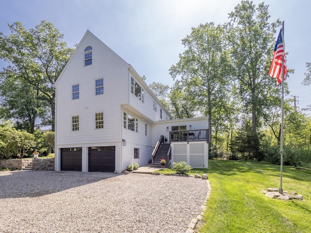 109 Westport Rd, Wilton, CT 06897 - view of front of house featuring stairway, a garage, gravel driveway, a front lawn, and a deck