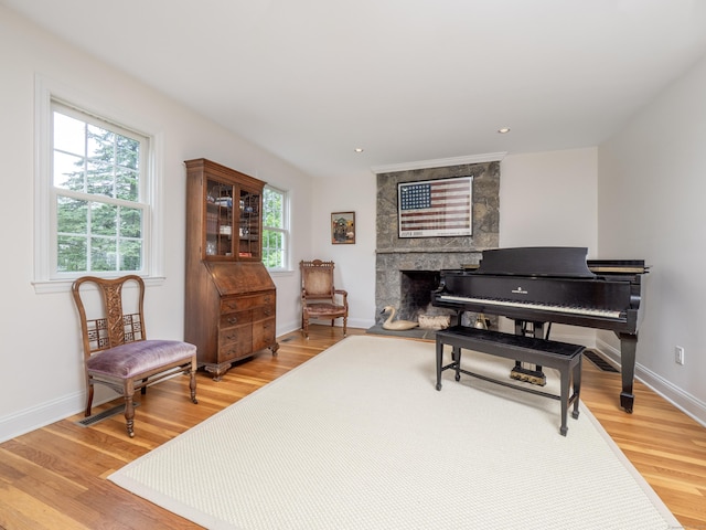 109 Westport Rd, Wilton, CT 06897 - sitting room with light wood-style flooring, a large fireplace, and recessed lighting