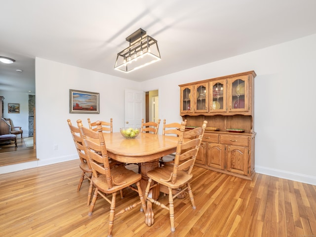 109 Westport Rd, Wilton, CT 06897 - dining area with light wood-type flooring and baseboards