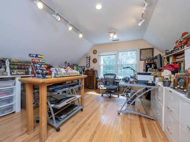 109 Westport Rd, Wilton, CT 06897 - home office featuring rail lighting, vaulted ceiling, and light wood-style floors