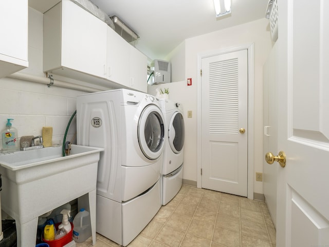 109 Westport Rd, Wilton, CT 06897 - washroom with cabinet space and independent washer and dryer