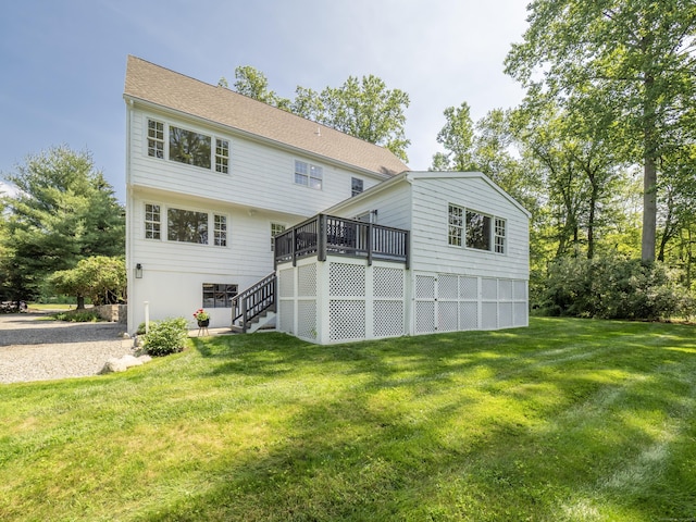 109 Westport Rd, Wilton, CT 06897 - rear view of house with stairway, a lawn, and a wooden deck