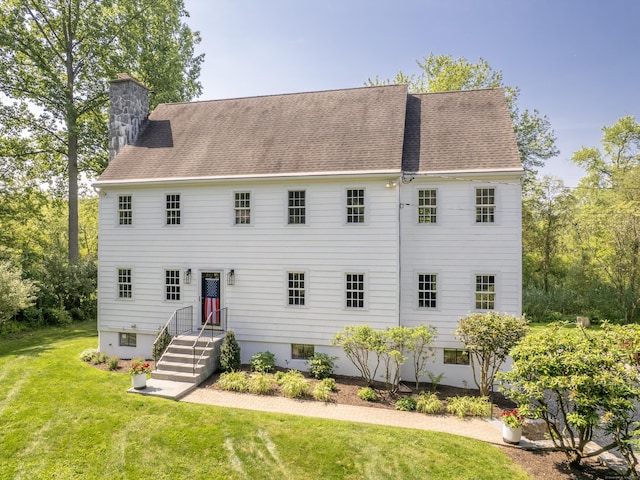109 Westport Rd, Wilton, CT 06897 - view of front of property with a chimney, a front yard, and roof with shingles