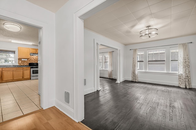 314 Judson Pl, Bridgeport, CT 06610 - interior space with light wood finished floors, healthy amount of natural light, and a chandelier