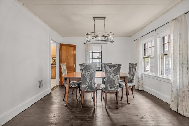 314 Judson Pl, Bridgeport, CT 06610 - dining space featuring plenty of natural light, ornamental molding, a chandelier, and dark wood-style flooring