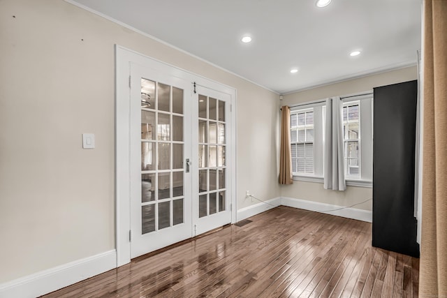 314 Judson Pl, Bridgeport, CT 06610 - unfurnished room featuring hardwood / wood-style flooring, ornamental molding, french doors, and recessed lighting