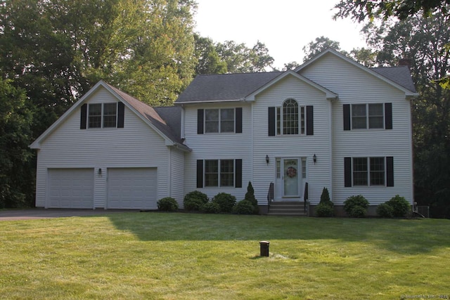 475 Niederwerfer Rd, South Windsor, CT 06074 - colonial inspired home with asphalt driveway, a garage, and a front yard