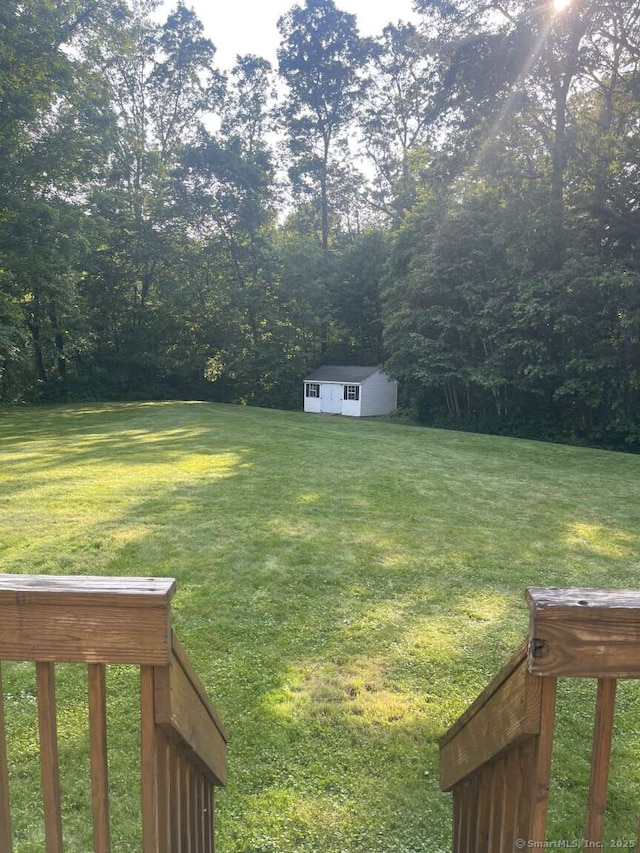 475 Niederwerfer Rd, South Windsor, CT 06074 - view of grassy yard featuring a shed and a view of trees