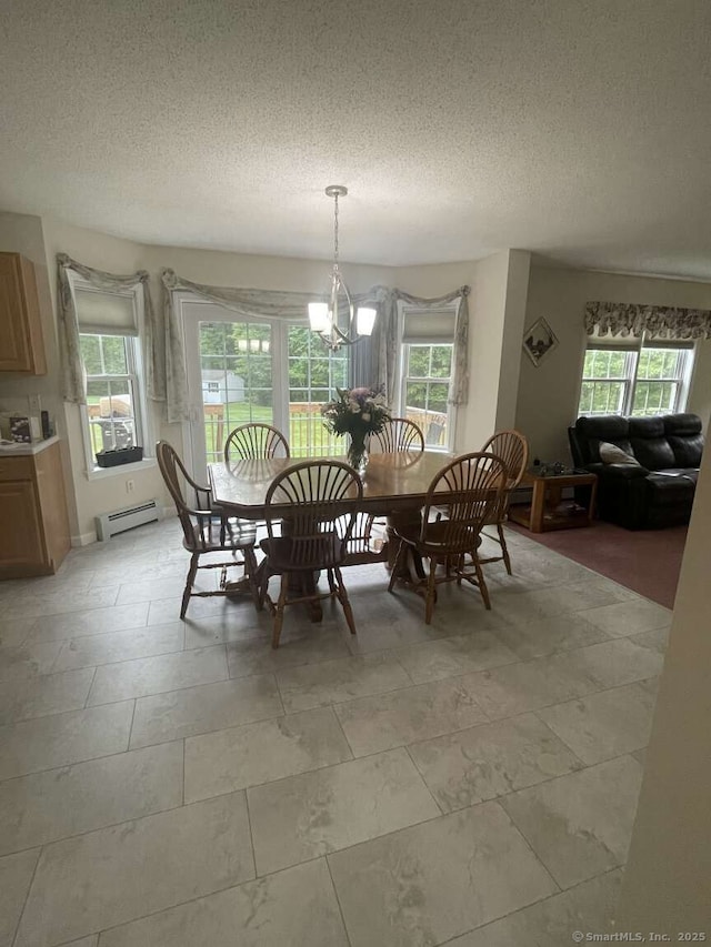 475 Niederwerfer Rd, South Windsor, CT 06074 - dining area featuring baseboard heating, a textured ceiling, and a chandelier