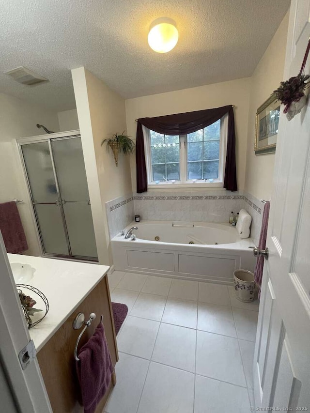 475 Niederwerfer Rd, South Windsor, CT 06074 - full bath with a textured ceiling, a tub with jets, a shower stall, tile patterned flooring, and vanity