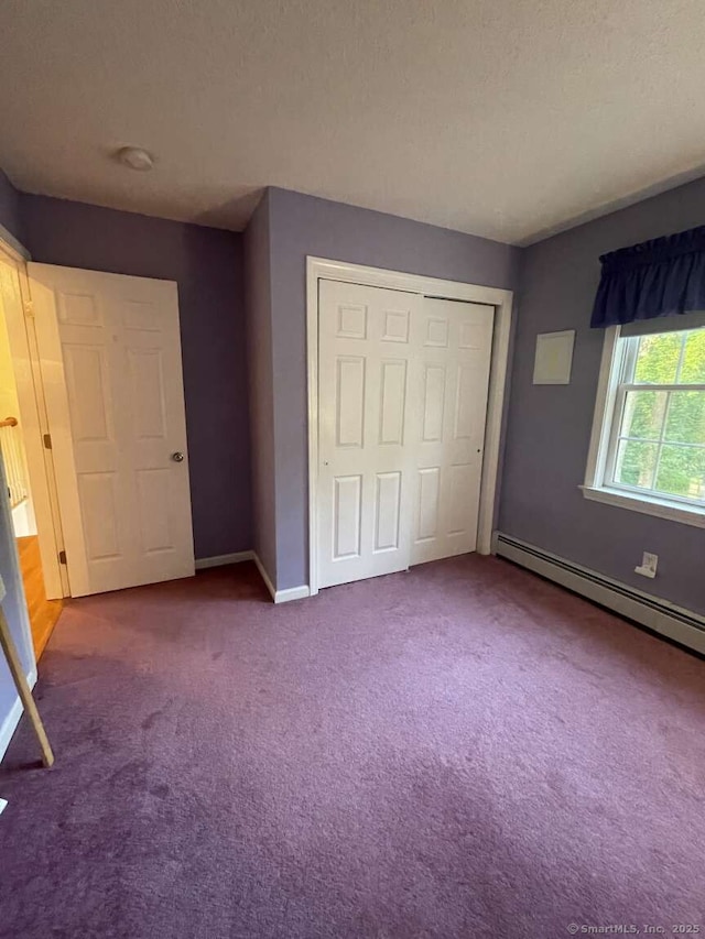 475 Niederwerfer Rd, South Windsor, CT 06074 - unfurnished bedroom with a baseboard radiator, carpet flooring, and a closet