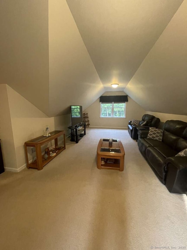 475 Niederwerfer Rd, South Windsor, CT 06074 - carpeted living area featuring vaulted ceiling and baseboards