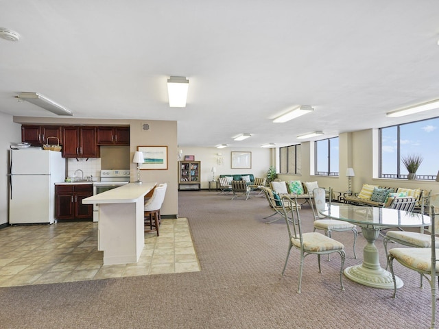 155 Brewster St Apt 3K, Bridgeport, CT 06605 - dining area featuring light carpet