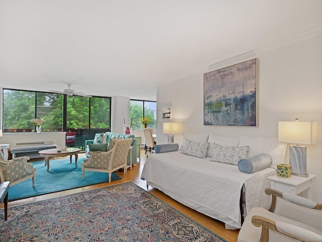 155 Brewster St Apt 3K, Bridgeport, CT 06605 - living area featuring crown molding, wood finished floors, and ceiling fan
