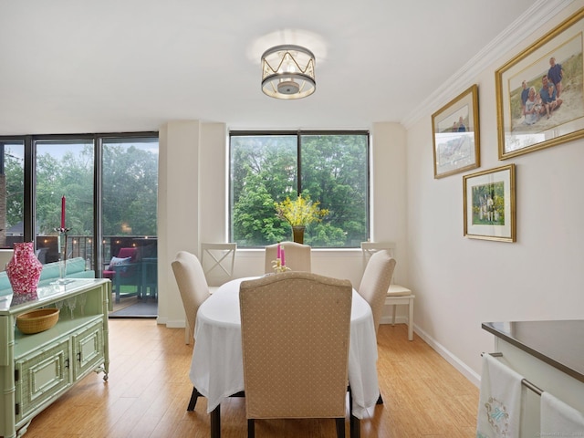 155 Brewster St Apt 3K, Bridgeport, CT 06605 - dining area with light wood-type flooring, ornamental molding, and a chandelier