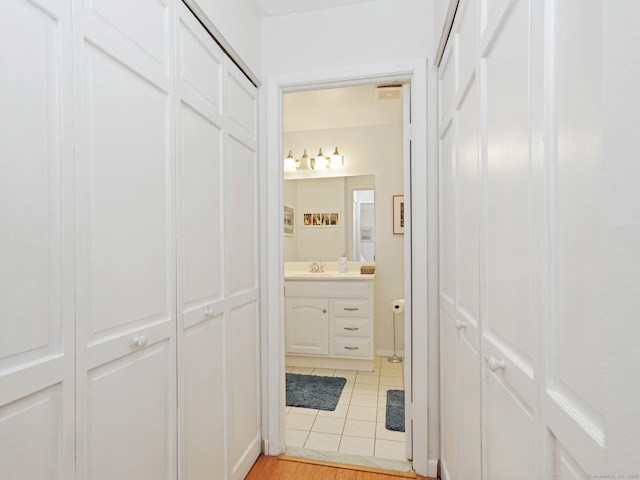 155 Brewster St Apt 3K, Bridgeport, CT 06605 - bathroom with vanity, a closet, and tile patterned floors