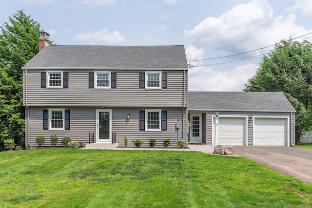 114 Boulter Rd, Wethersfield, CT 06109 - colonial house featuring a chimney, an attached garage, asphalt driveway, a front lawn, and a shingled roof