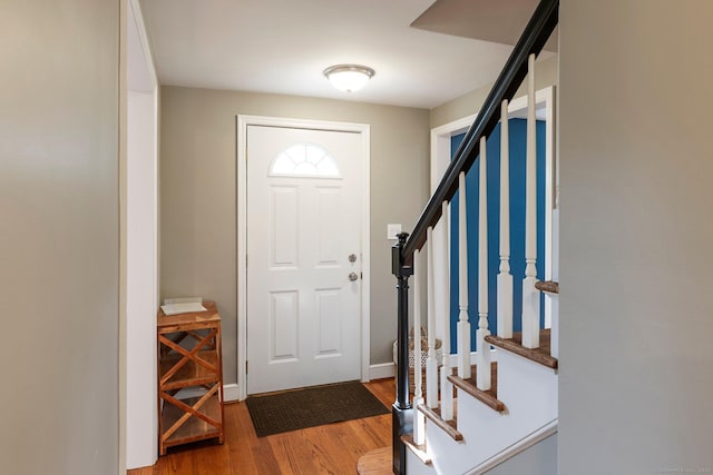 114 Boulter Rd, Wethersfield, CT 06109 - foyer featuring wood finished floors and stairs