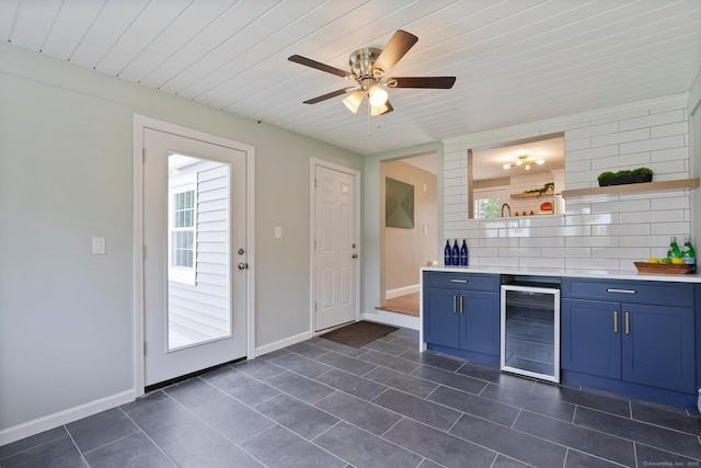 114 Boulter Rd, Wethersfield, CT 06109 - kitchen with beverage cooler, open shelves, blue cabinets, plenty of natural light, and wooden ceiling