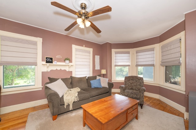 45 Harris Fuller Rd, Preston, CT 06365 - living area with wood finished floors, a ceiling fan, and ornamental molding