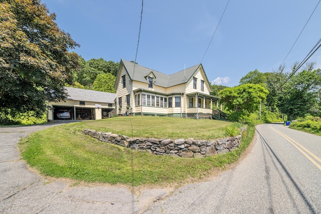 45 Harris Fuller Rd, Preston, CT 06365 - view of front of house featuring driveway, a carport, and a front lawn