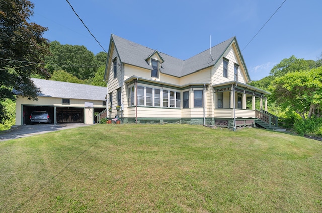 45 Harris Fuller Rd, Preston, CT 06365 - view of front of property with a detached garage, a front yard, and an outbuilding
