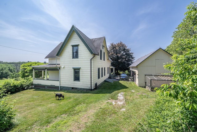 45 Harris Fuller Rd, Preston, CT 06365 - back of property with a lawn and a shingled roof
