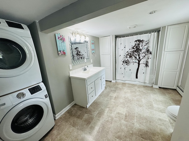 34 Park St, Griswold, CT 06351 - washroom with estacked washer and dryer and baseboard heating