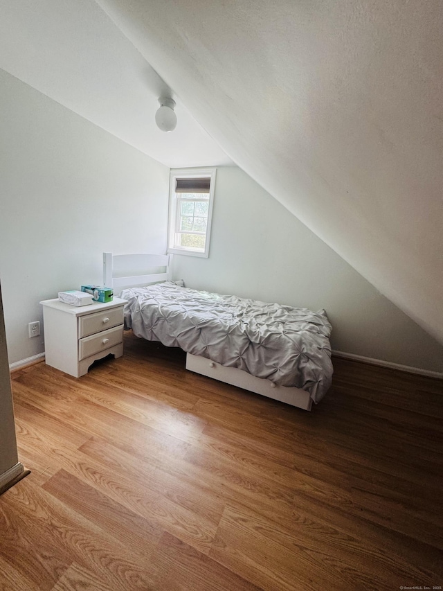 34 Park St, Griswold, CT 06351 - bedroom with vaulted ceiling and light wood-style floors