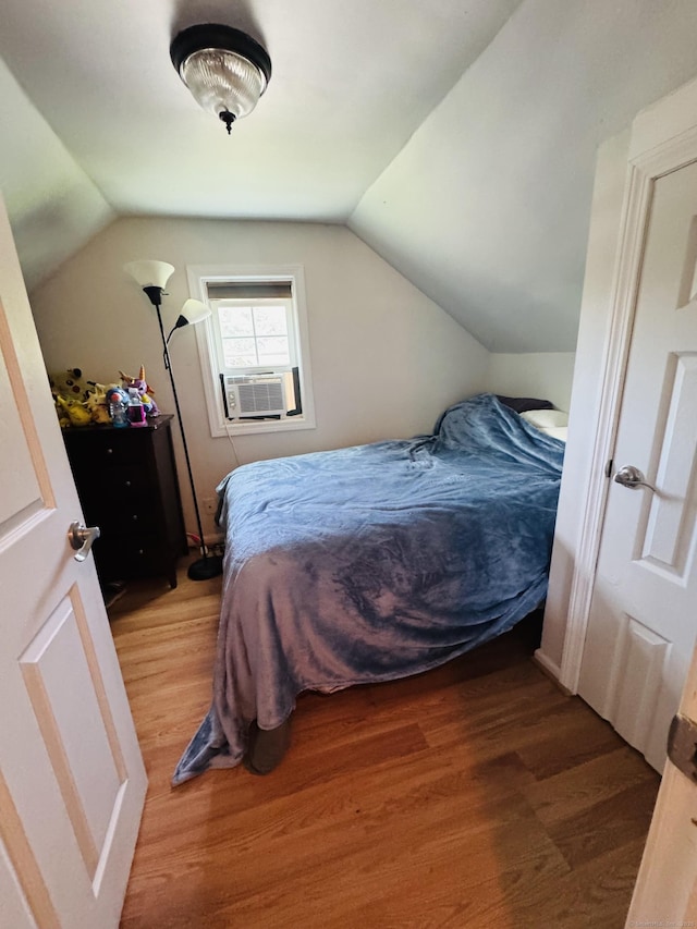 34 Park St, Griswold, CT 06351 - bedroom with light wood-style flooring, lofted ceiling, and cooling unit