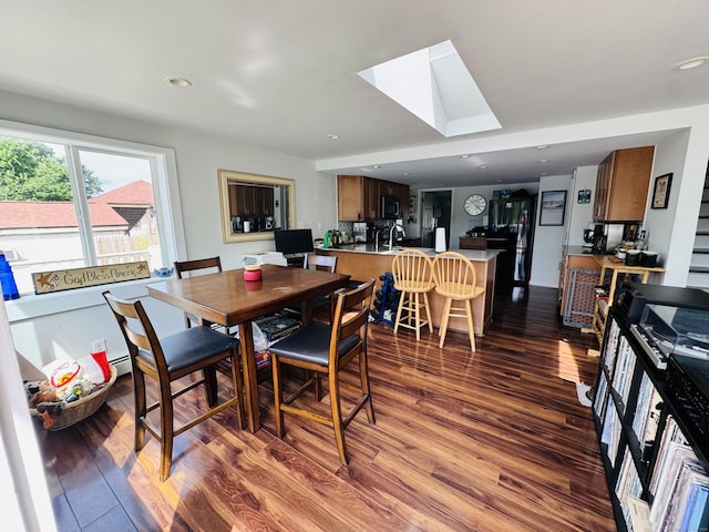 34 Park St, Griswold, CT 06351 - dining space featuring wood finished floors, a skylight, and recessed lighting