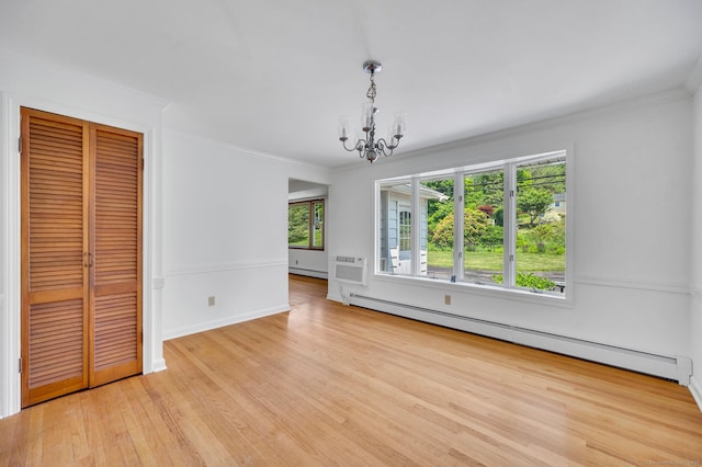 442 Merrow Rd, Tolland, CT 06084 - unfurnished dining area featuring a baseboard heating unit, a chandelier, light wood finished floors, crown molding, and a wall mounted AC