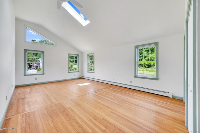 442 Merrow Rd, Tolland, CT 06084 - spare room featuring a baseboard radiator, wood finished floors, plenty of natural light, a skylight, and high vaulted ceiling