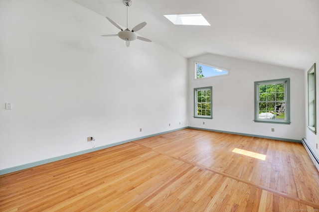 442 Merrow Rd, Tolland, CT 06084 - empty room with ceiling fan, wood finished floors, a skylight, and high vaulted ceiling