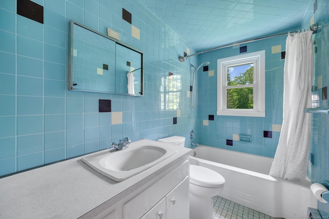 442 Merrow Rd, Tolland, CT 06084 - full bath with tile walls, vanity, shower / bathtub combination with curtain, tile patterned floors, and decorative backsplash