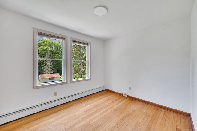 442 Merrow Rd, Tolland, CT 06084 - spare room featuring baseboard heating and hardwood / wood-style floors