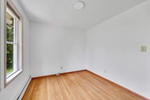 442 Merrow Rd, Tolland, CT 06084 - empty room with a baseboard radiator and light wood finished floors
