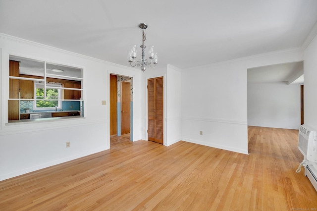 442 Merrow Rd, Tolland, CT 06084 - unfurnished room with a chandelier, wood finished floors, crown molding, and baseboard heating