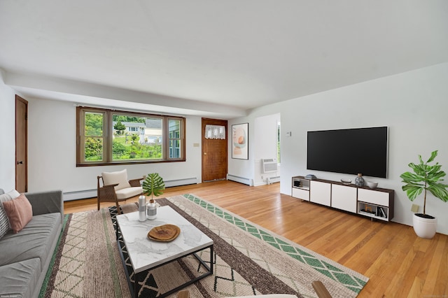 442 Merrow Rd, Tolland, CT 06084 - living area with light wood-style flooring, baseboard heating, and an AC wall unit