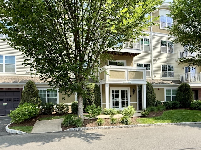 34 Schoolhouse Dr Unit 405, West Hartford, CT 06110 - view of front of property featuring stucco siding and french doors